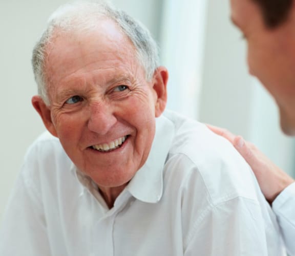 Doctor talking to an older male patient